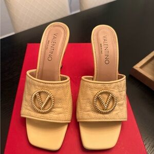 Valentino Cream Quilted Mules with Gold Emblem